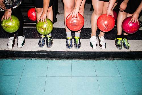 leisure activities person holding bowling balls bowl